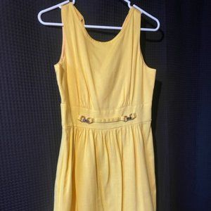Eliza J Sleeveless Yellow Dress with gold belt detail and bow back